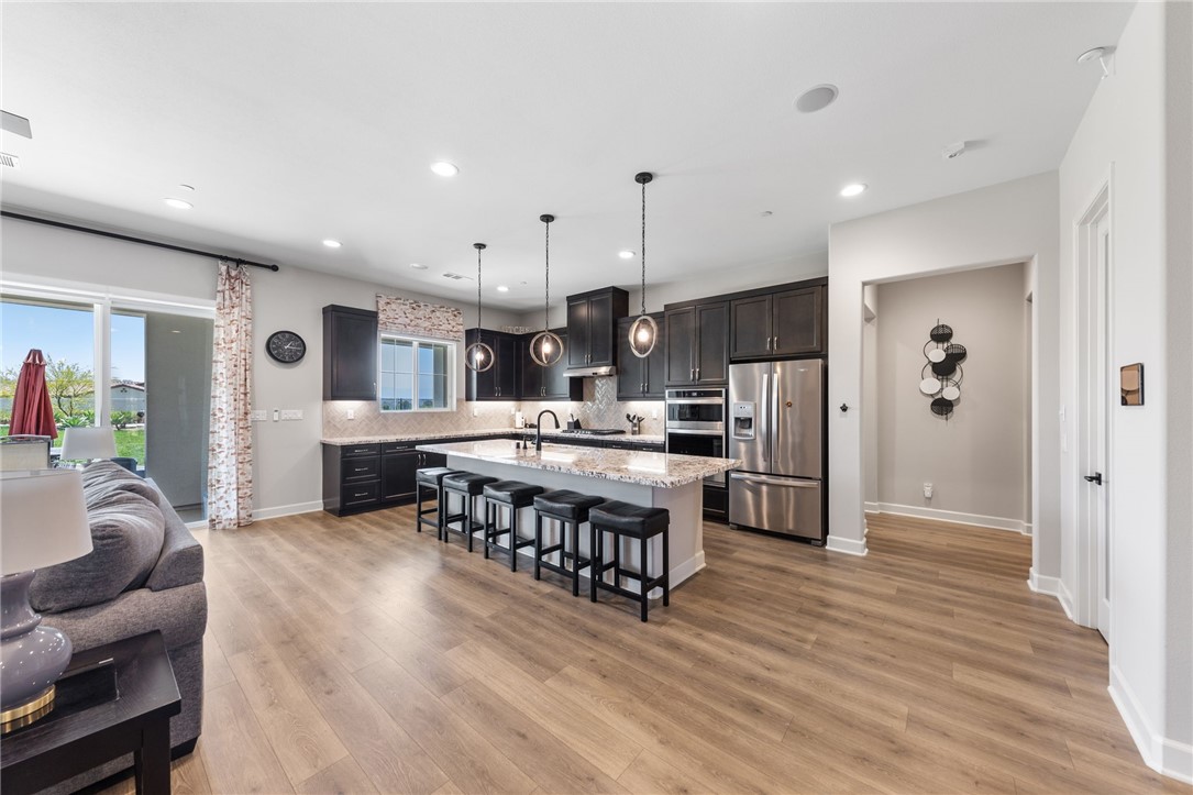 7631 Capstone Court Riverside, CA 92506 - Photo 9 of 39 Seamless flow between the kitchen, dining area, and great room.