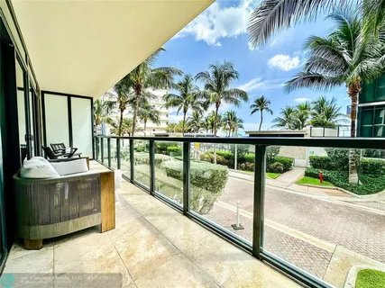 a view of swimming pool from a balcony