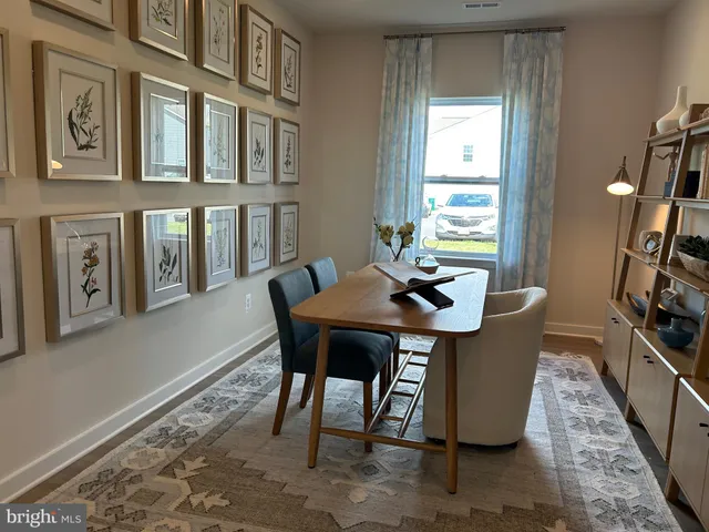 a bedroom with a bed and a mirror