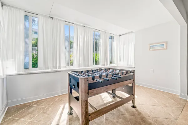 a view of room with window and furniture