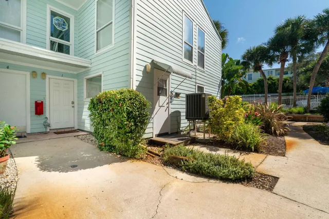 a view of a backyard with potted plants