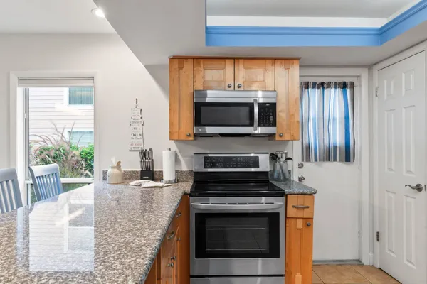 a kitchen with a stove and a microwave