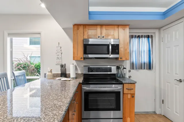 a kitchen with a stove and a microwave