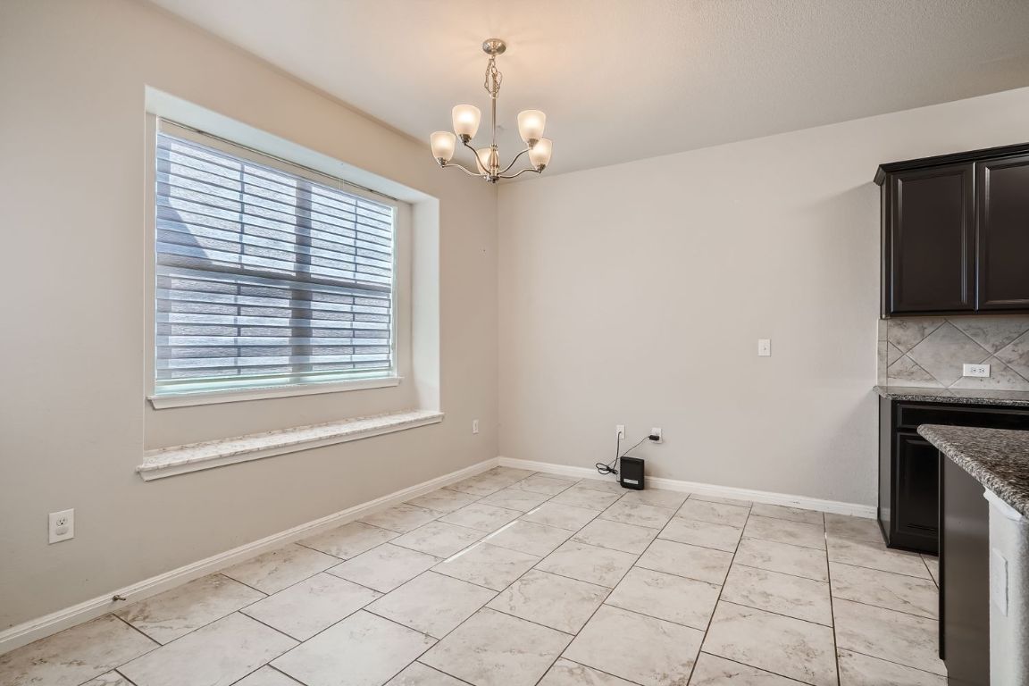 403 Epiphany Lane Pflugerville, TX 78660 - Photo 13 of 29 a view of an empty room with a window