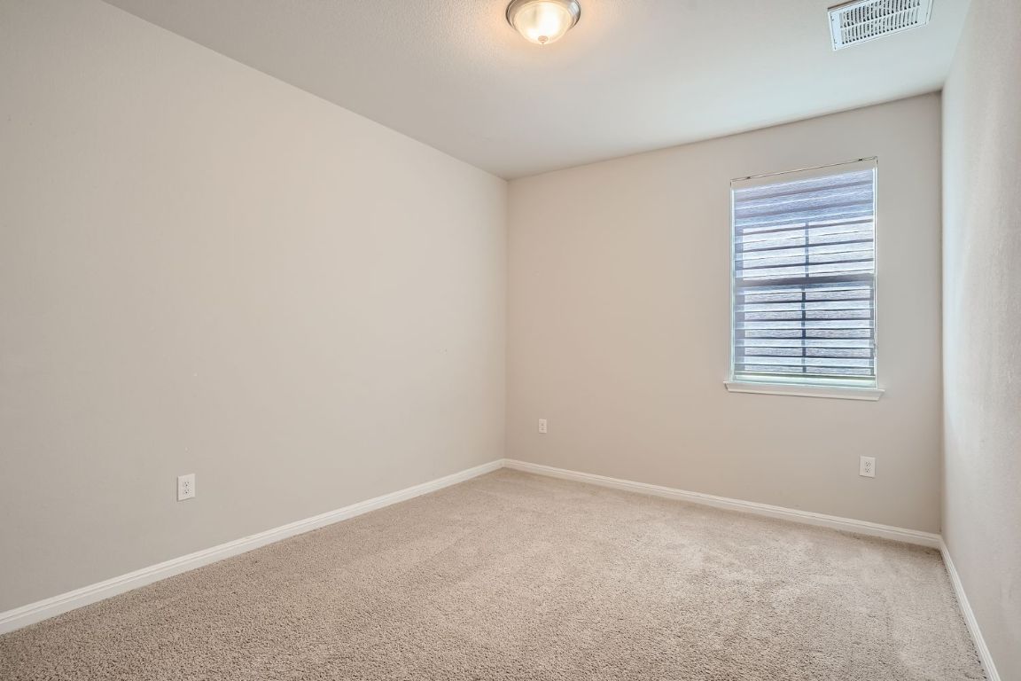 403 Epiphany Lane Pflugerville, TX 78660 - Photo 20 of 29 an empty room with a window