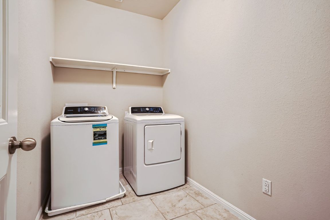 403 Epiphany Lane Pflugerville, TX 78660 - Photo 21 of 29 a utility room with dryer and washer