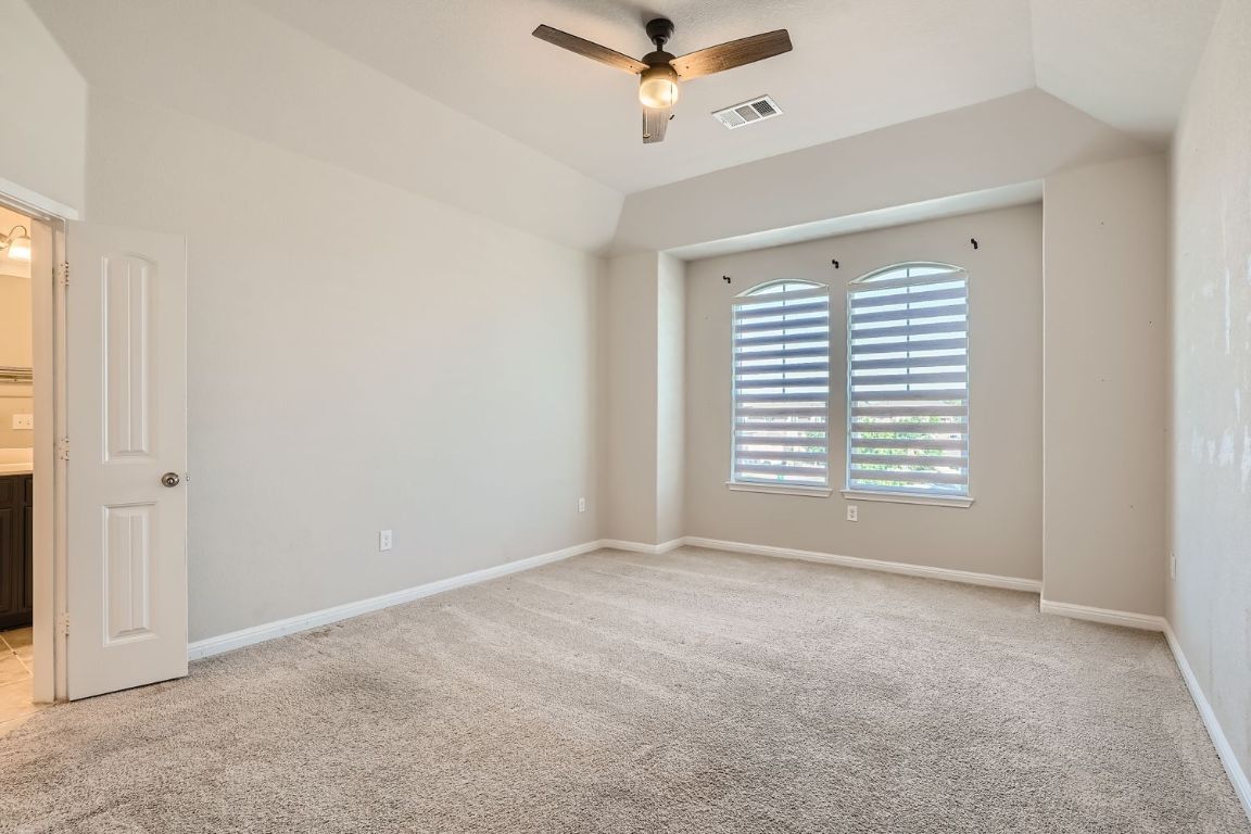 403 Epiphany Lane Pflugerville, TX 78660 - Photo 3 of 29 a view of an empty room with a window