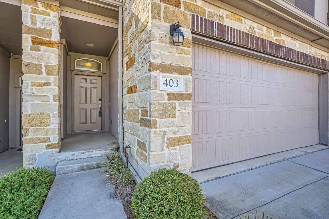 403 Epiphany Lane Pflugerville, TX 78660 - Photo 6 of 29 a view of a brick house with a large windows