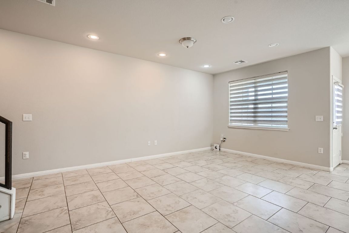 403 Epiphany Lane Pflugerville, TX 78660 - Photo 9 of 29 a view of an empty room with a window
