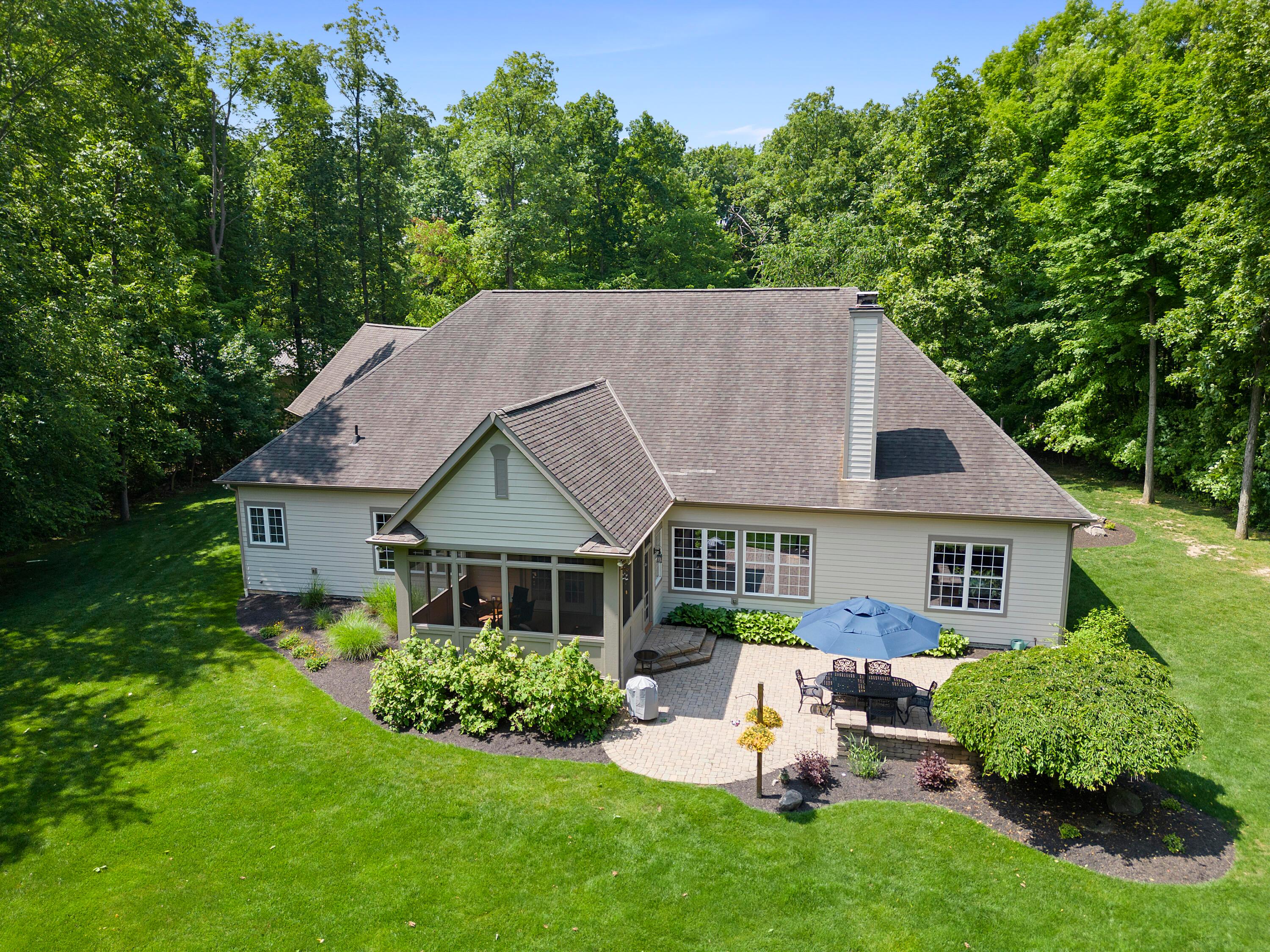 5761 Hughes Road Galena, OH 43021 - Photo 41 of 43 5.002 acre mostly wooded property with beautiful, level yard area. Custom 520 SF paver Patio with kneewall, Exceptional privacy and natural beauty all around. Fenced garden area for fruit & vegetable cultivation, professionally landscaped gardens all around the house.