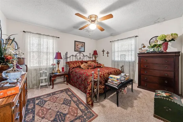 a bedroom with a bed and a table in it