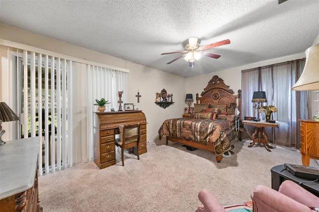 a bedroom with furniture and a chandelier