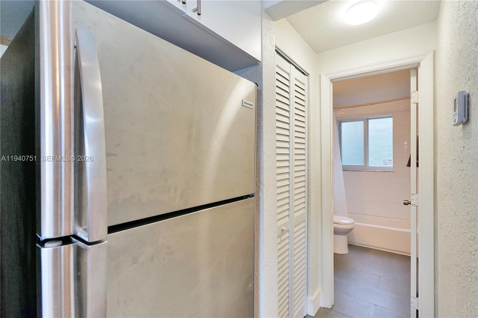 60 Northwest 76th Street, Unit 16 Miami, FL 33150 - Photo 14 of 23 a view of bathroom with a shower and a toilet