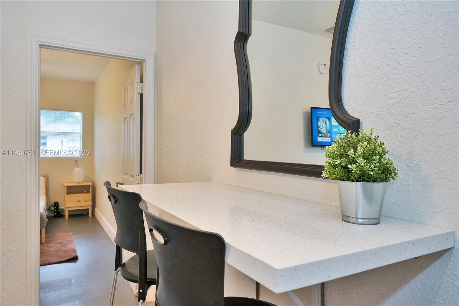 60 Northwest 76th Street, Unit 16 Miami, FL 33150 - Photo 3 of 23 a close view of dining table with chairs