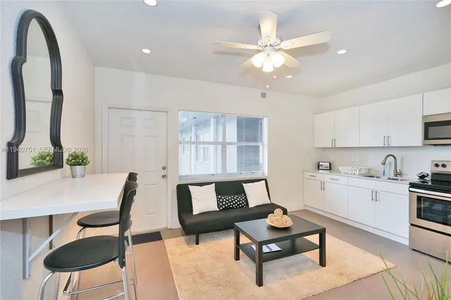 a living room with furniture and a window