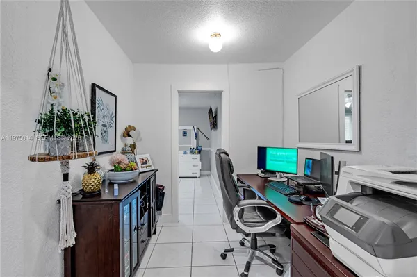 a view of a workspace with furniture