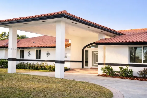 a front view of a house with yard