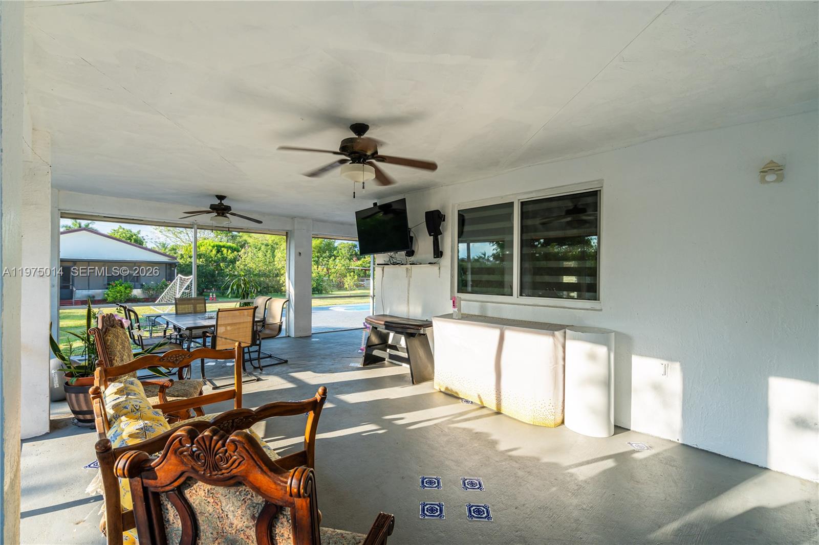 20825 Southwest 242nd Street Homestead, FL 33031 - Photo 38 of 52 a view of a dining room with furniture window and outside view