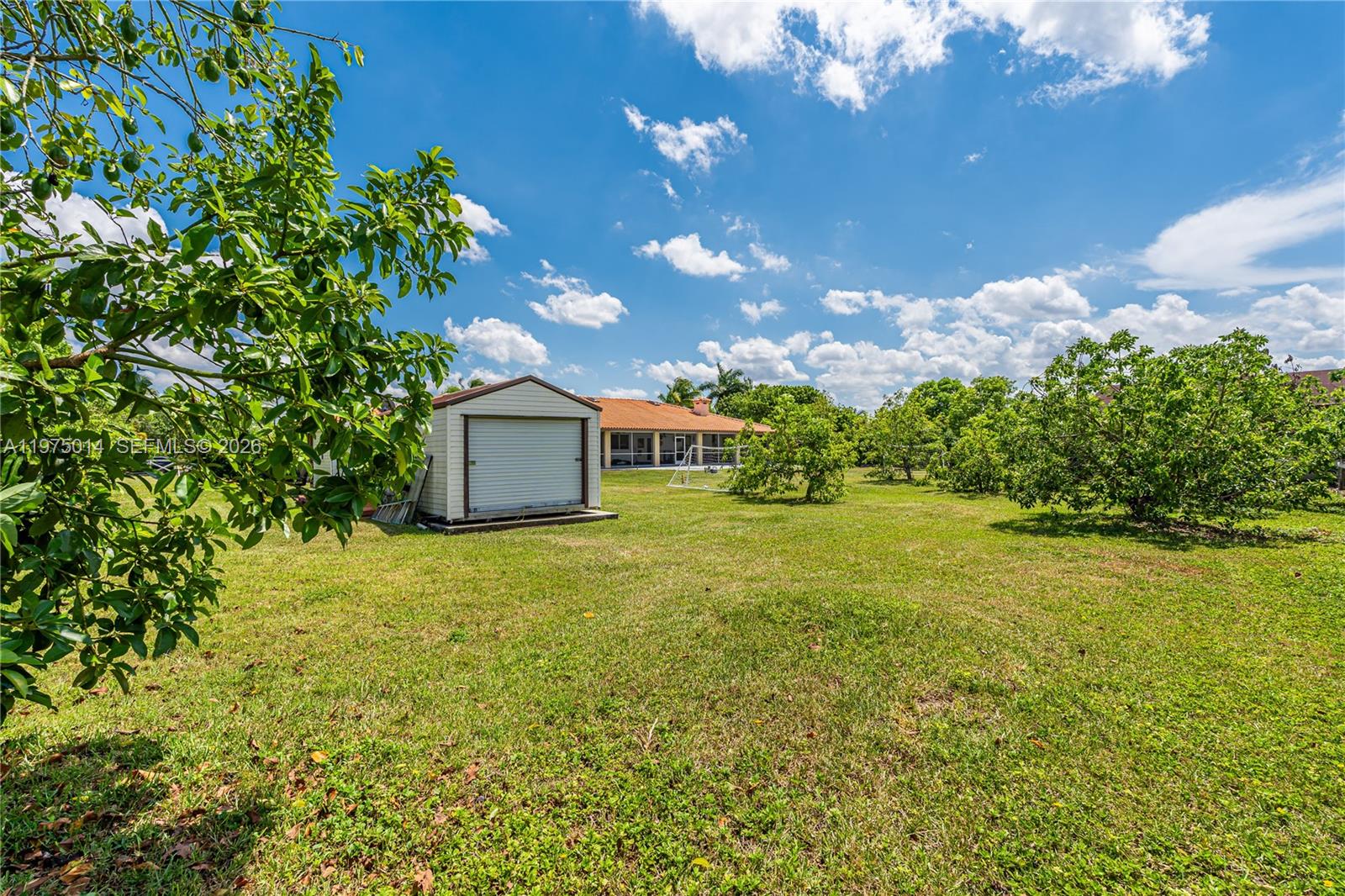 20825 Southwest 242nd Street Homestead, FL 33031 - Photo 47 of 52 a house view with a garden space