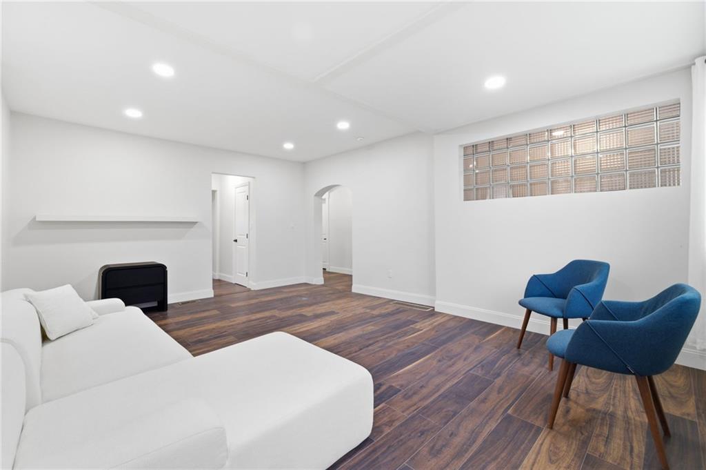 3 3rd Avenue Braddock, PA 15104 - Photo 11 of 46 a living room with furniture and a fireplace