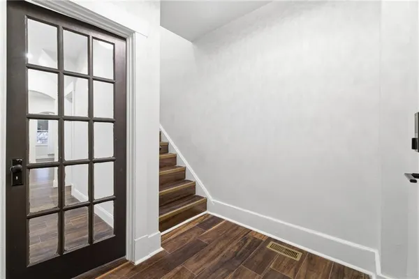 a view of entryway with wooden floor