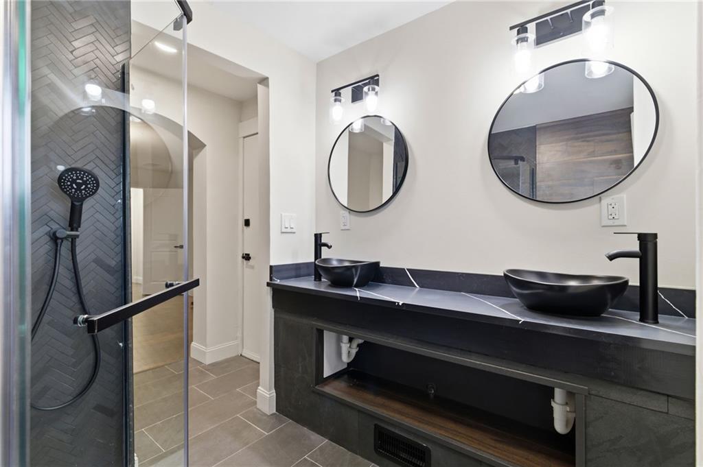3 3rd Avenue Braddock, PA 15104 - Photo 31 of 46 a bathroom with a double vanity sink and a mirror