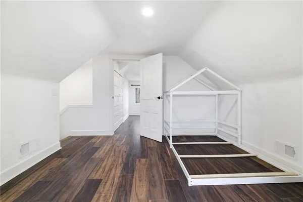 a view of an entryway with wooden floor