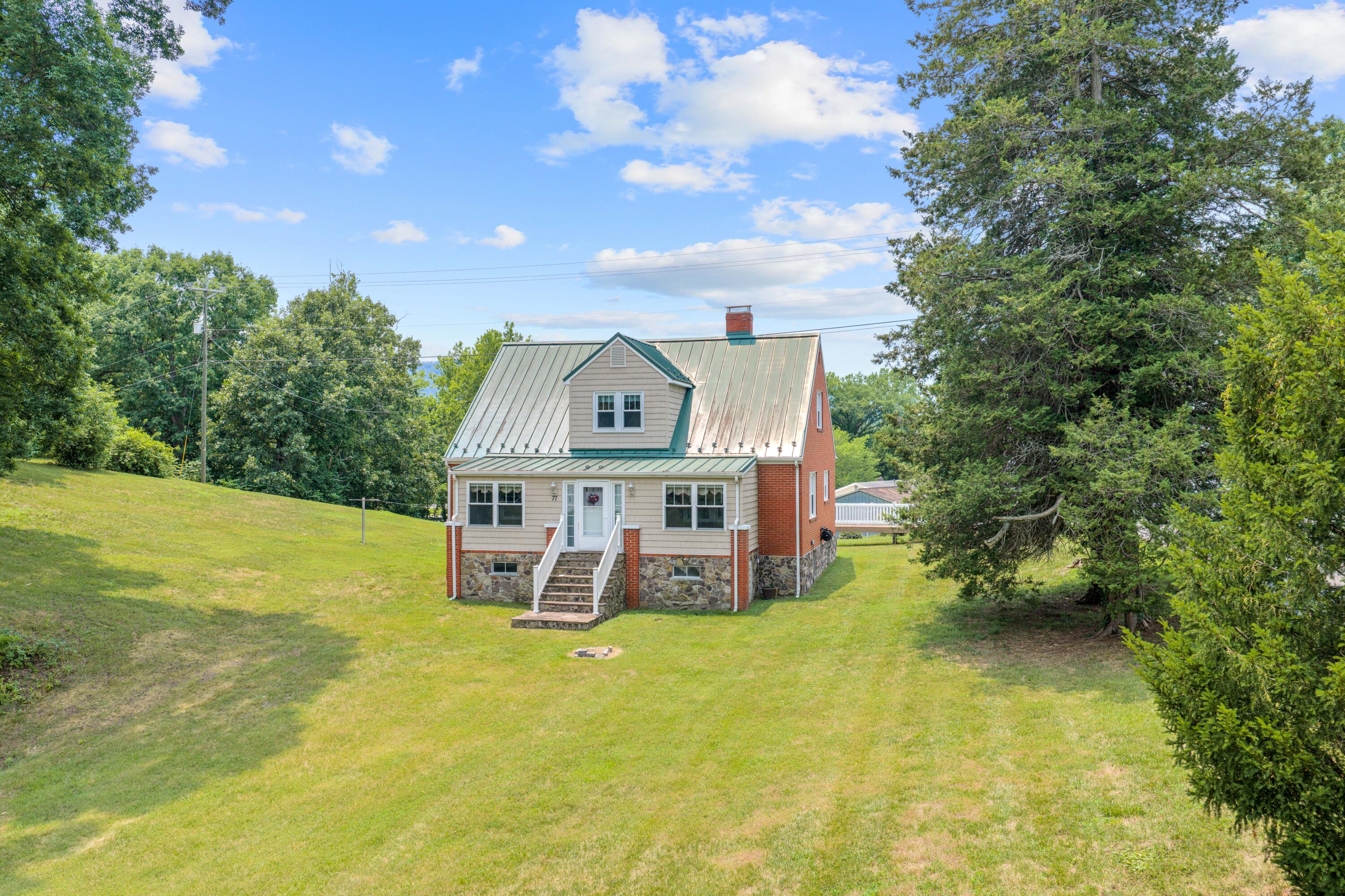 77 Mountain Pass Road Blue Ridge, VA 24064 - Photo 1 of 25 a view of a house with a swimming pool