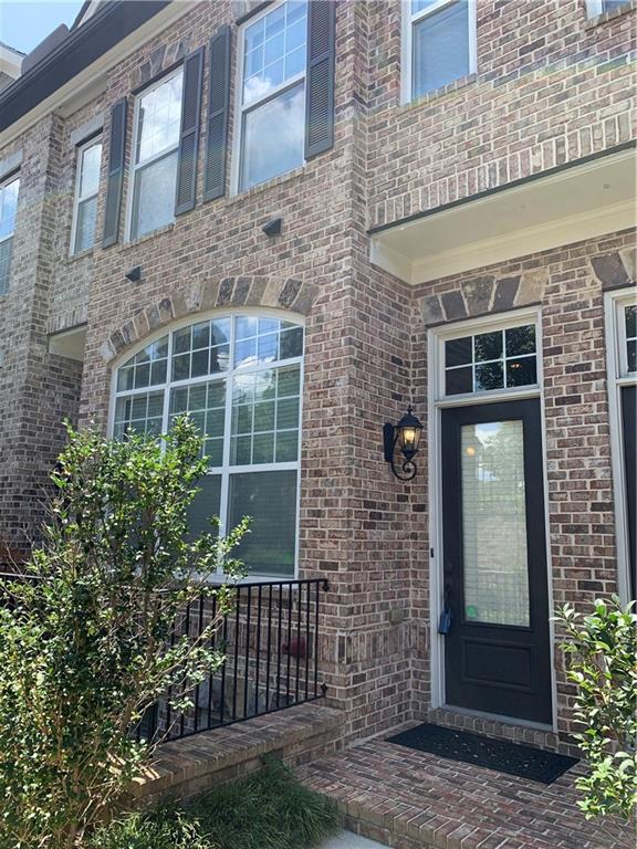 1615 Rivers Edge Trail Northeast Atlanta, GA 30324 - Photo 2 of 26 a view of a brick house with a large windows