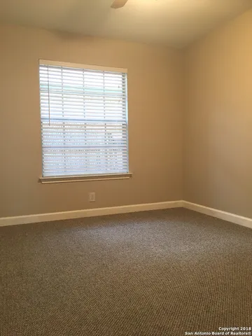 an empty room with wooden floor