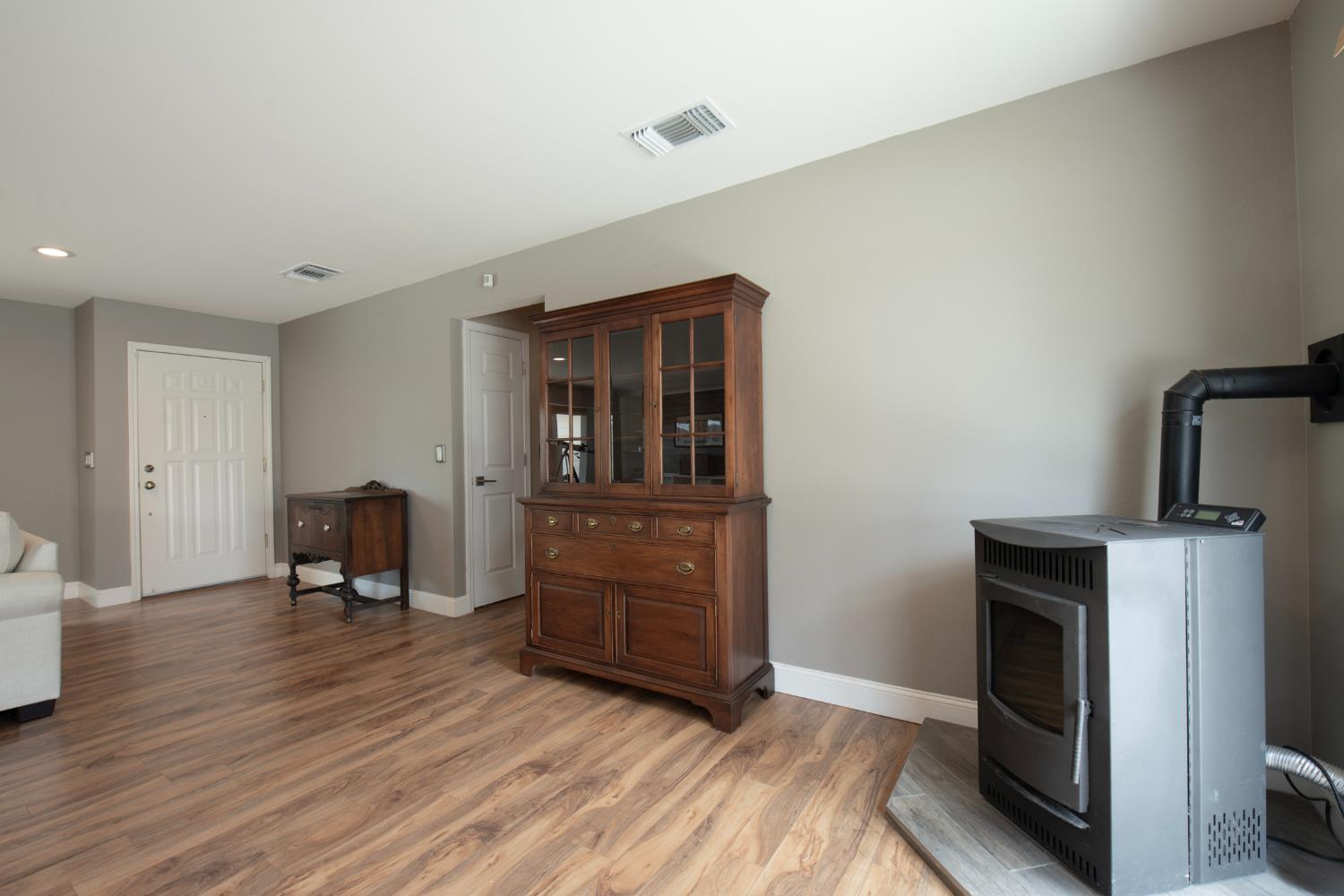 29395 Revis Road Coarsegold, CA 93614 - Photo 14 of 32 a room with furniture and a fireplace