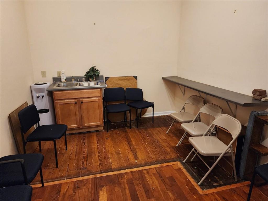 6958 Main Street Lithonia, GA 30058 - Photo 45 of 55 a living room with furniture and a wooden floor