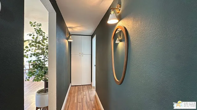 a view of a bathroom with a tub and shower