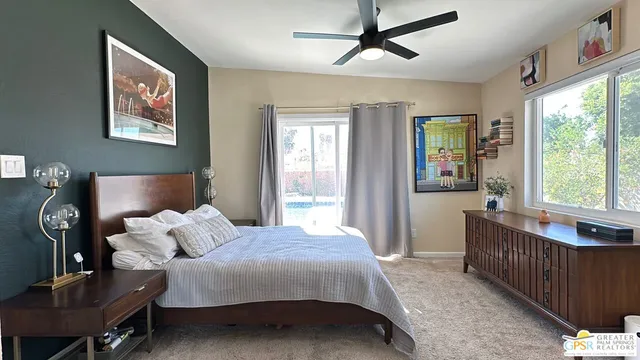 a bedroom with furniture and windows