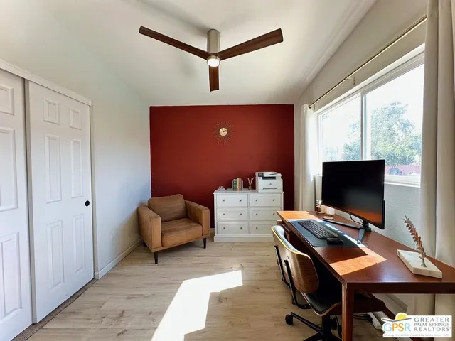 a workspace with furniture and window