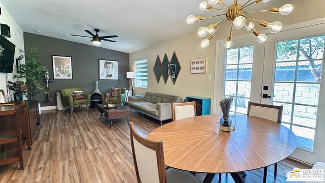 a living room with fireplace furniture and a wooden floor