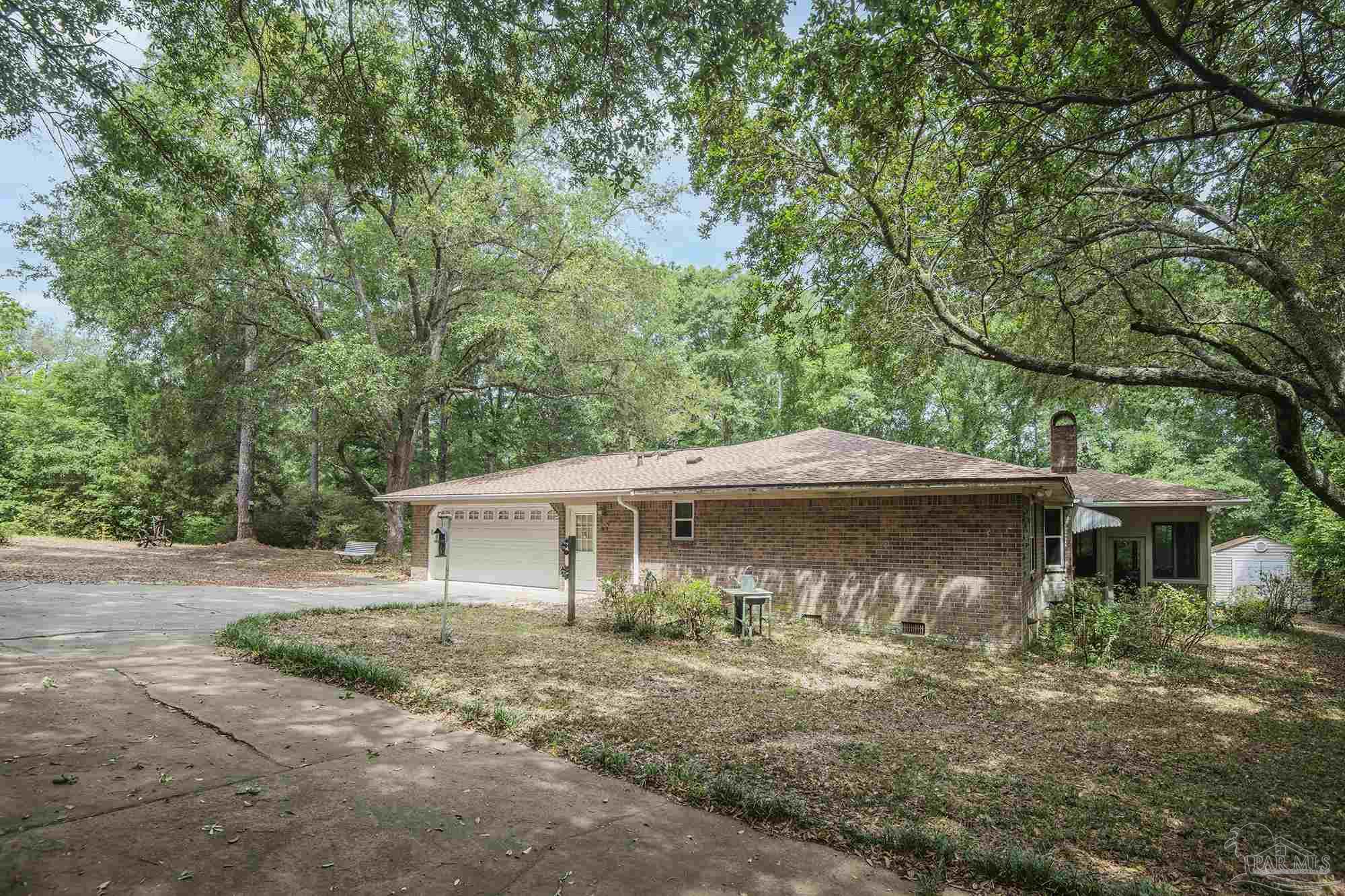 1210 Goldenrod Road Cantonment, FL 32533 - Photo 48 of 50 front view of a house with a yard