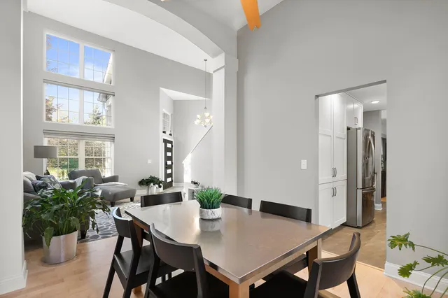 a kitchen with center island table and chairs