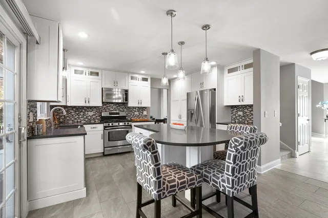a kitchen with a sink and cabinets