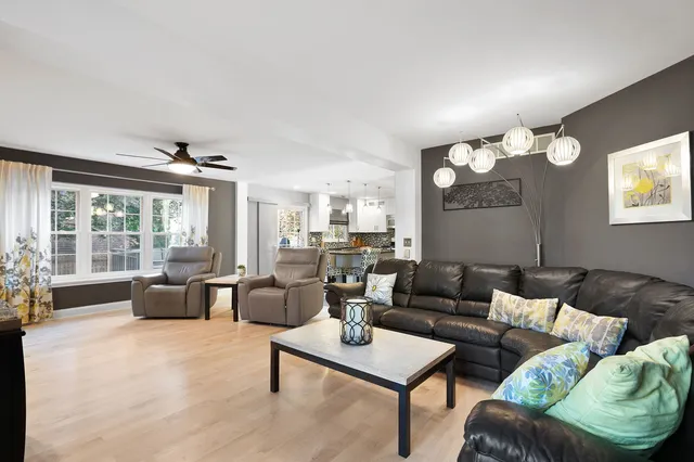 a living room with furniture and a lamp