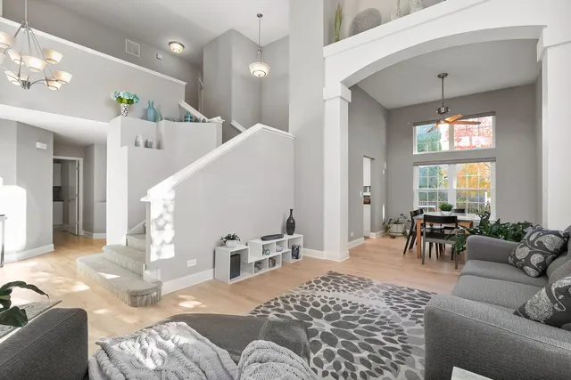 a living room with furniture or couch and a large window