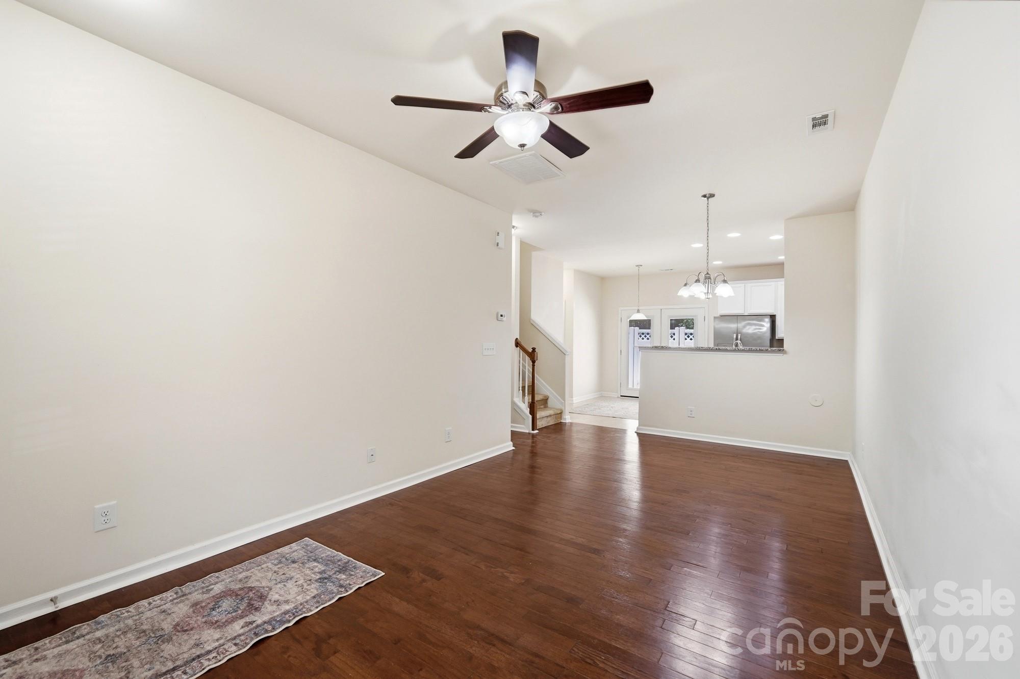 175 Limerick Road, Unit B Mooresville, NC 28115 - Photo 5 of 30 a view of an empty room with wooden floor