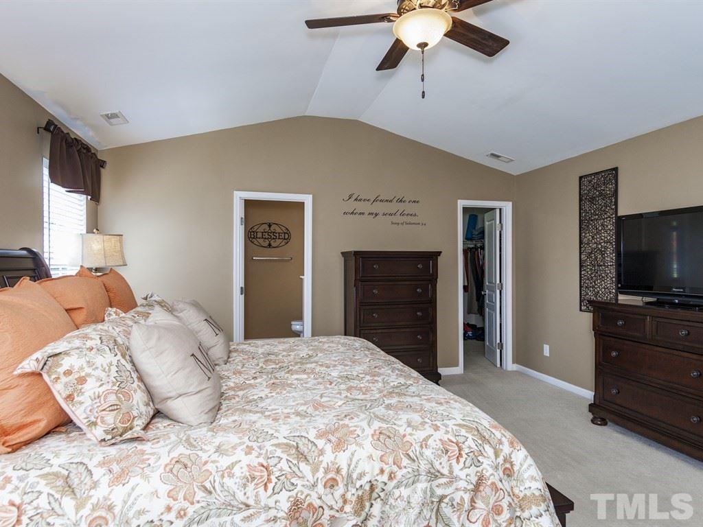 300 Hope Valley Road Knightdale, NC 27545 - Photo 15 of 25 a bedroom with a bed and a flat screen tv
