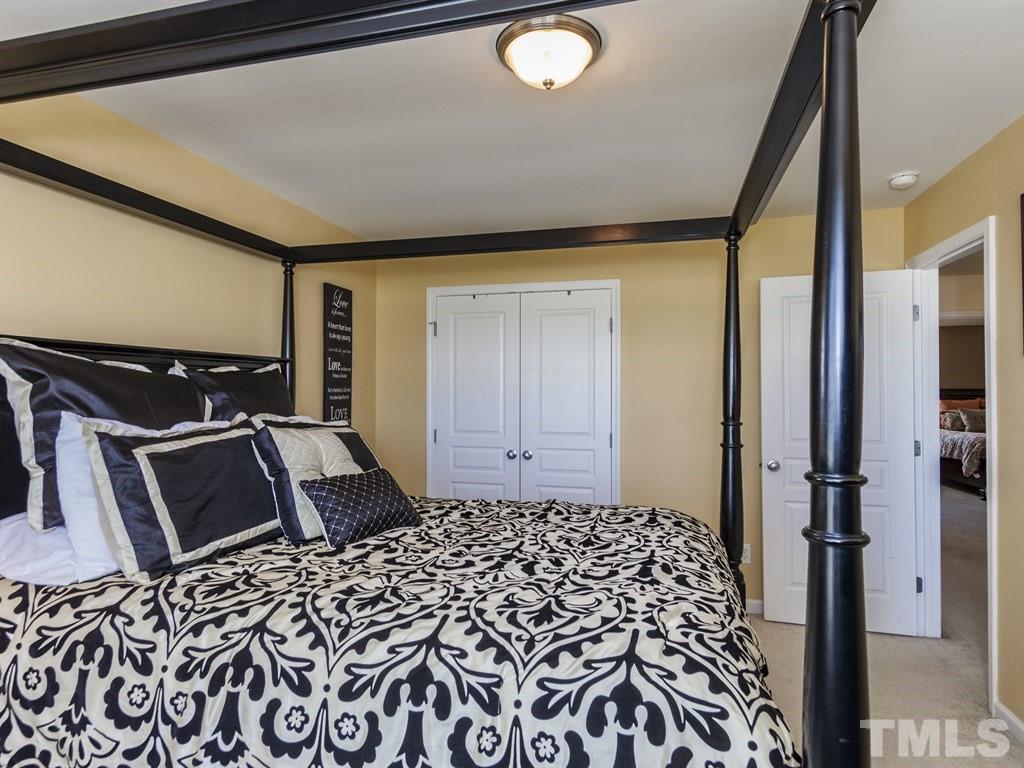 300 Hope Valley Road Knightdale, NC 27545 - Photo 18 of 25 a bedroom with a bed and a window