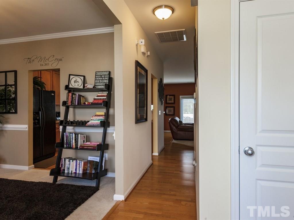 300 Hope Valley Road Knightdale, NC 27545 - Photo 3 of 25 a view of a hallway with wooden floor and furniture