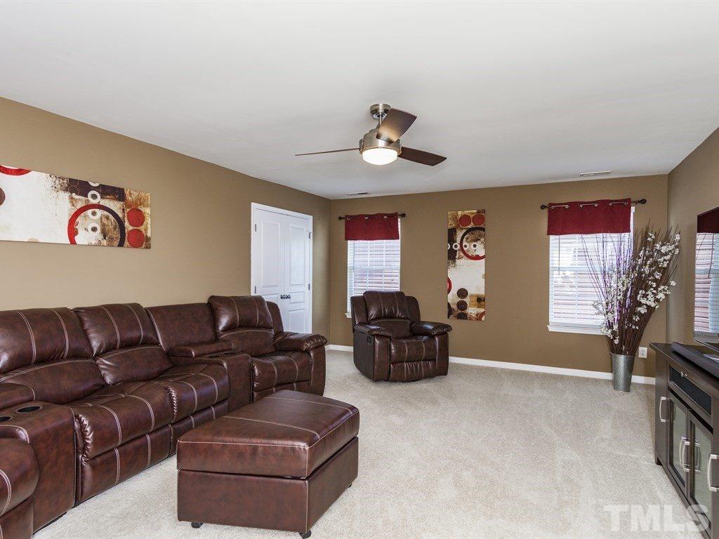 300 Hope Valley Road Knightdale, NC 27545 - Photo 21 of 25 a living room with furniture ceiling fan and a window