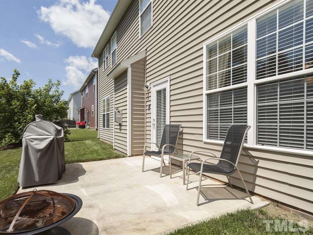 300 Hope Valley Road Knightdale, NC 27545 - Photo 23 of 25 a view of a patio with a table and chairs and a barbeque