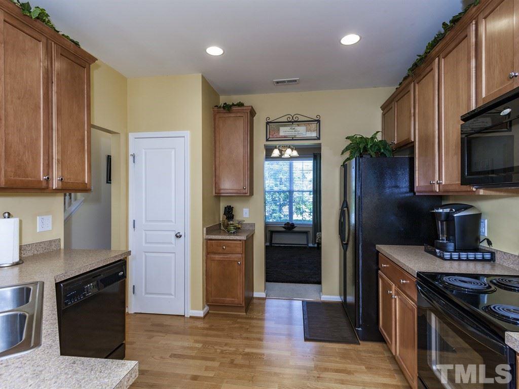 300 Hope Valley Road Knightdale, NC 27545 - Photo 7 of 25 a kitchen with stainless steel appliances granite countertop a refrigerator stove and sink