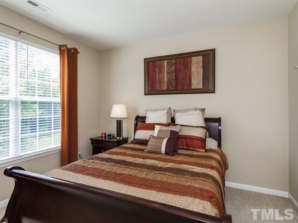 300 Hope Valley Road Knightdale, NC 27545 - Photo 9 of 25 a bedroom with a bed and a window