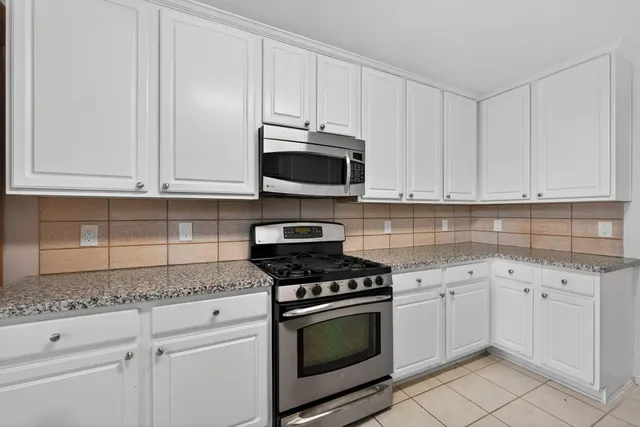 a view of a kitchen with furniture and a kitchen view
